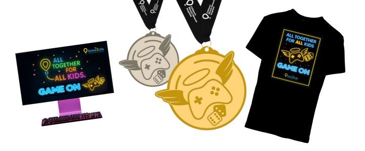 2026 Extra Life platinum swag for players includes sticker, blue t-shirt with Extra Life illustration, silver, and gold medals